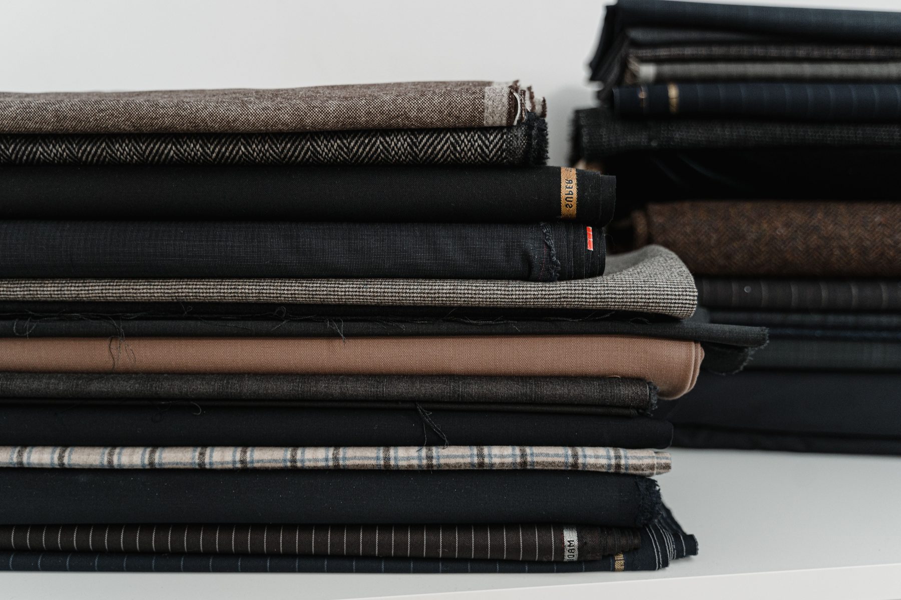 Folded fabric stack for apparel fabric GSM and color confirmation